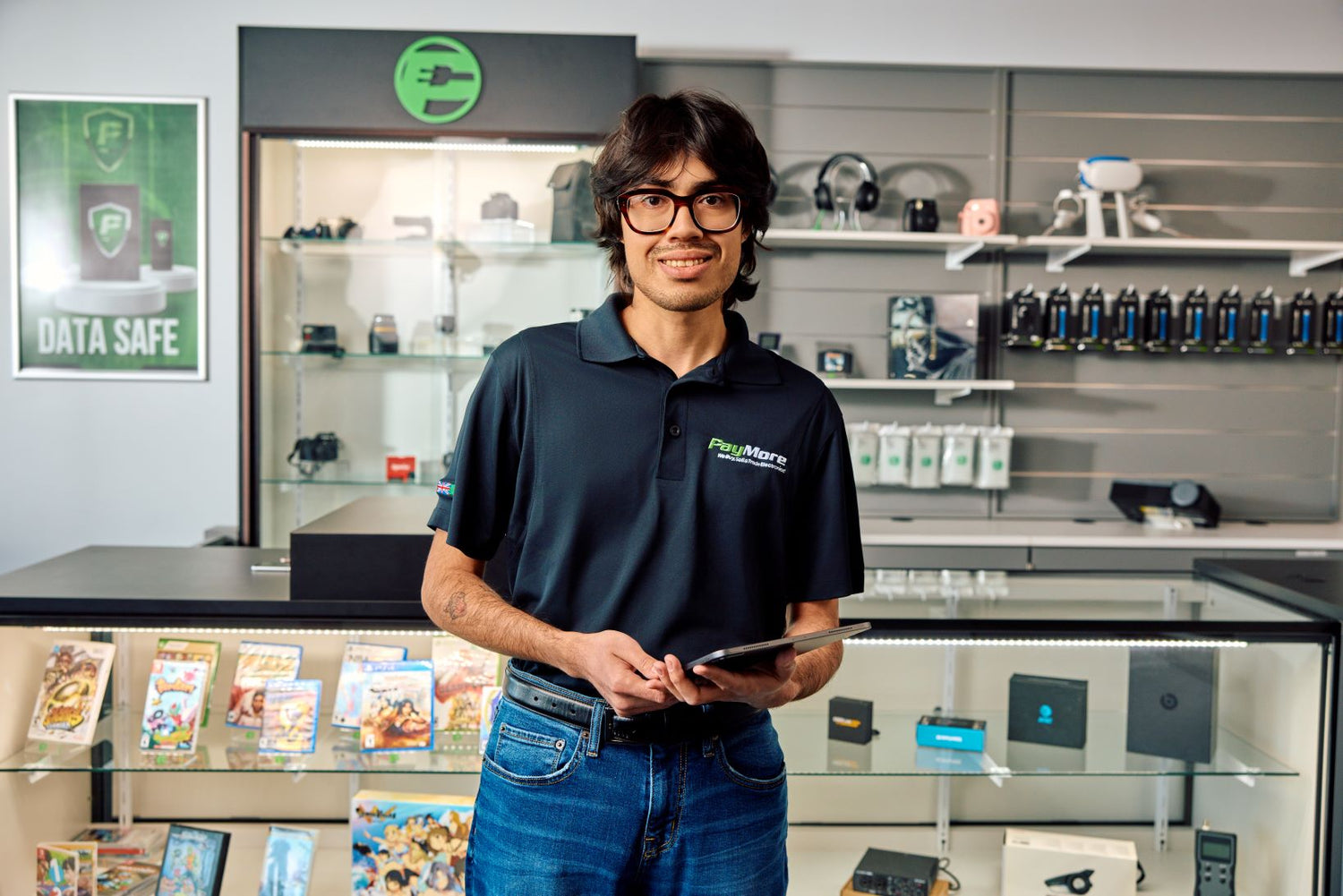 paymore employee smiling and holding tablet